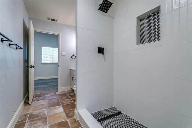a bathroom with a sink and a shower