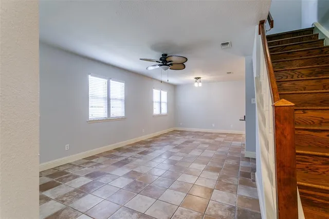 a view of an empty room and a windows