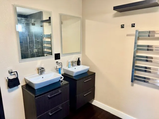 a bathroom with a sink and mirror