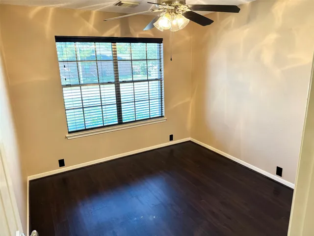 a bathroom with a sink and mirror with toilet