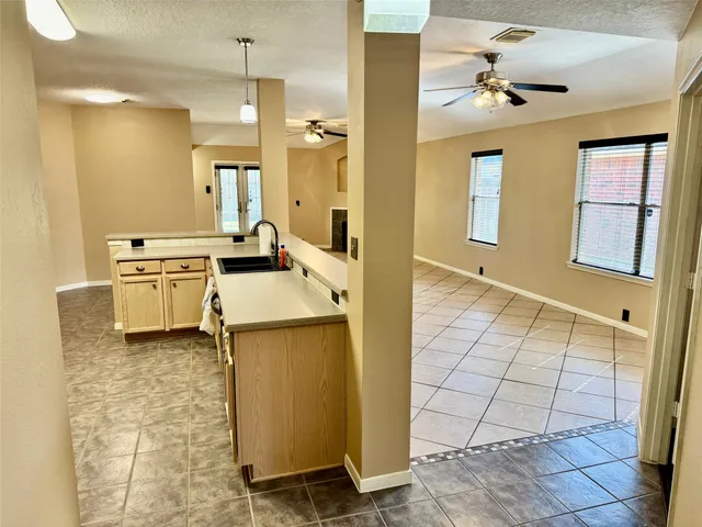 a bathroom with a sink a mirror and shower