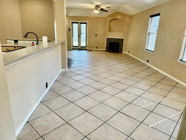 a view of a bathroom with a sink and a mirror