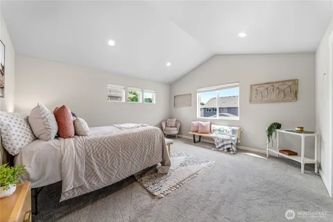 a bedroom with a bed and window