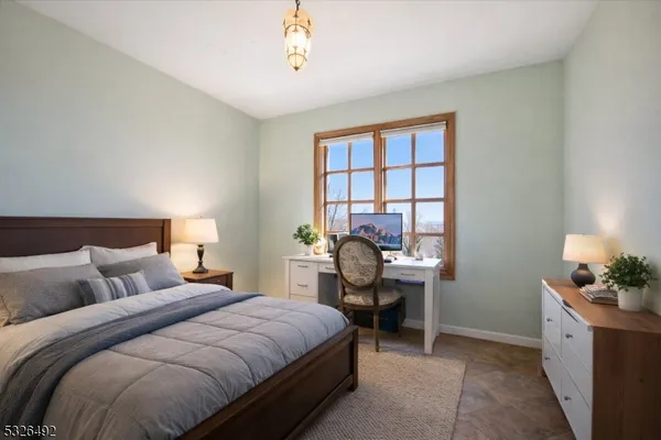 a bedroom with a bed and a table