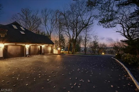 a view of large tree in front of a house