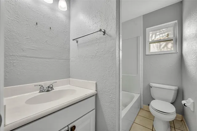 a bathroom with a sink toilet and vanity