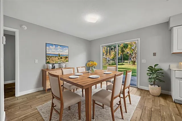 a dining room with furniture and window