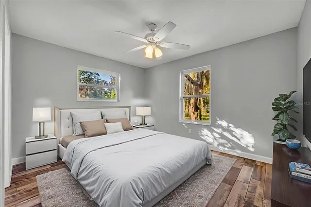 a bedroom with a bed and a window