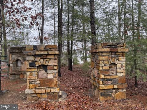 183 Wilson Road Capon Bridge, WV 26711 - Photo 2 of 10 a backyard of a house with outdoor seating