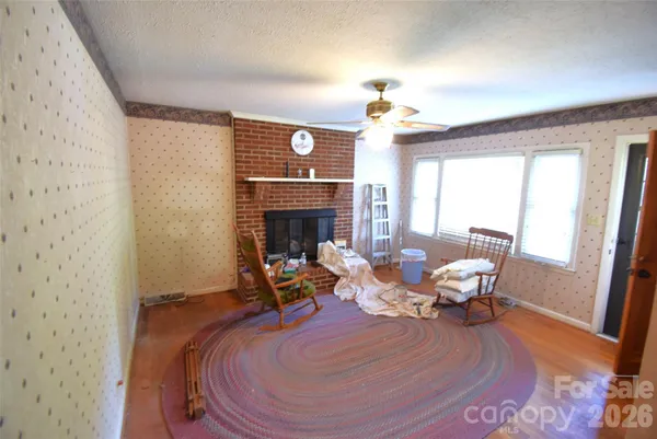 a view of a dining room with furniture and a chandelier