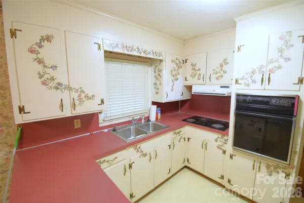 a view of cabinets and wooden floor