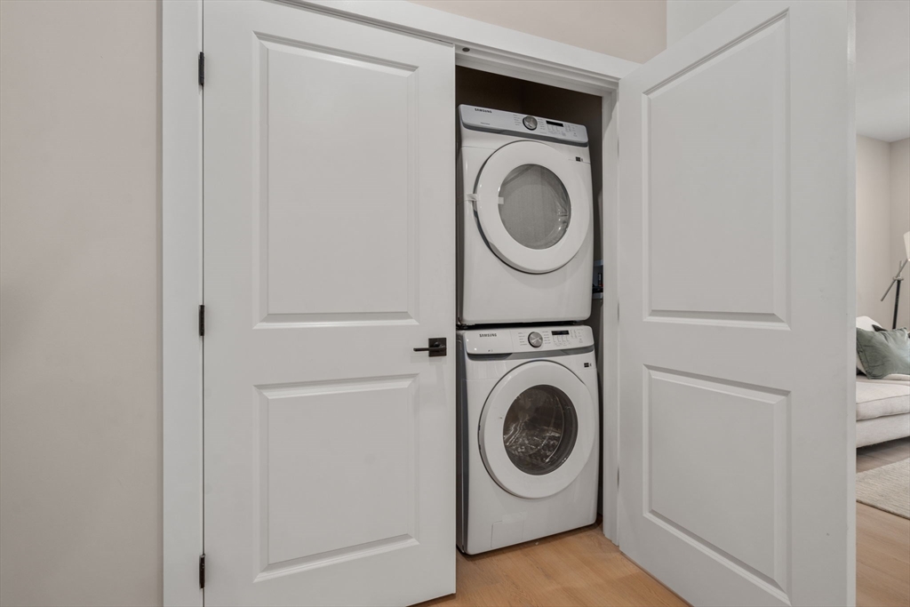 7 Cross Street, Unit 306 Wilmington, MA 01887 - Photo 5 of 14 a utility room with dryer and washer