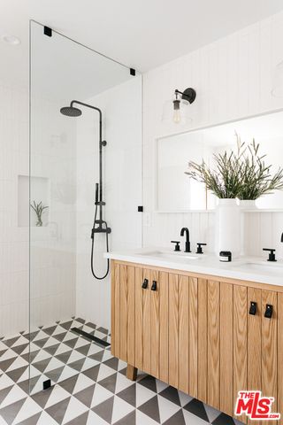 a bathroom with a bathtub and a shower