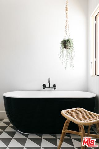 a room with a table chairs and appliances