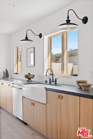a kitchen with sink and window