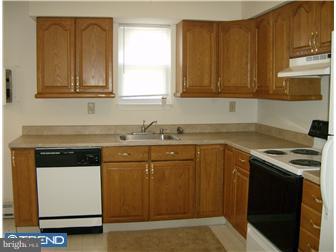 134 Hampshire Road Sicklerville, NJ 08081 - Photo 7 of 12 a kitchen with granite countertop cabinets stainless steel appliances and a sink