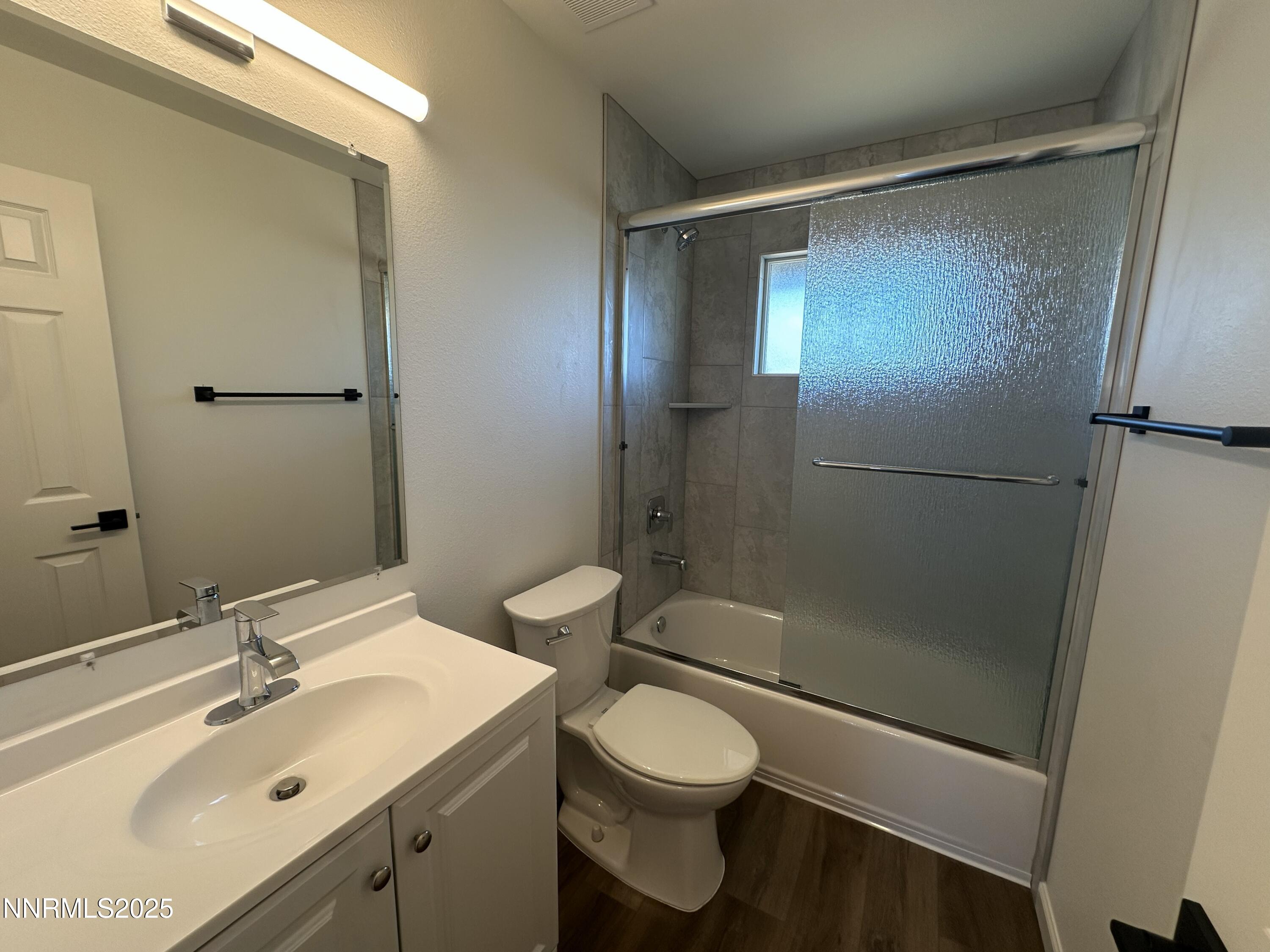2380 Orange Lane Reno, NV 89502 - Photo 15 of 15 a bathroom with a sink mirror vanity and toilet