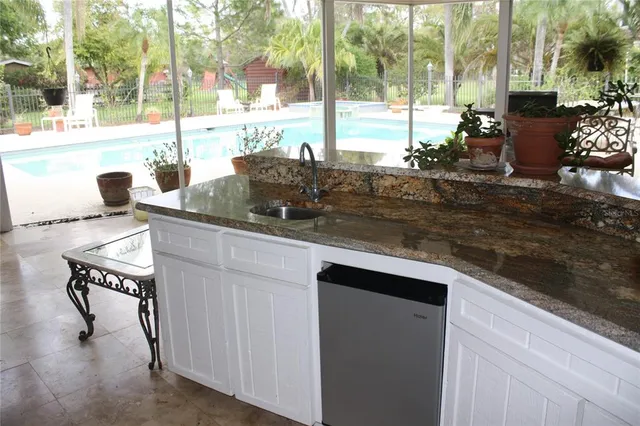 a view of living room with a table and chairs