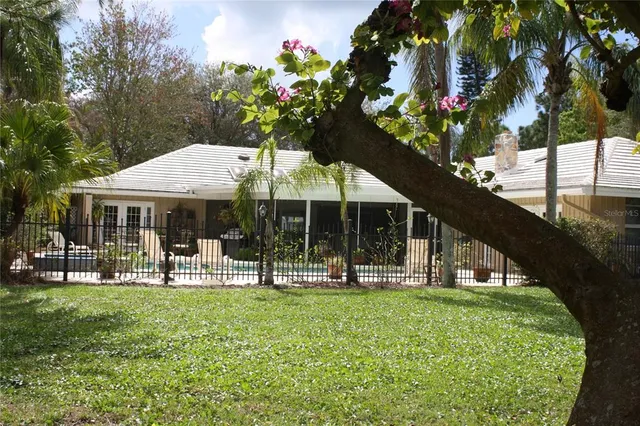 a front view of house with a garden