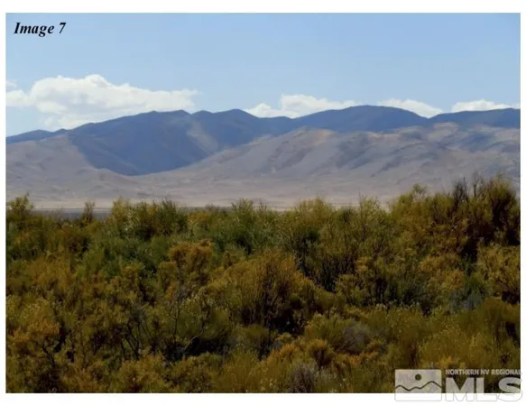 a view of a house with a mountain