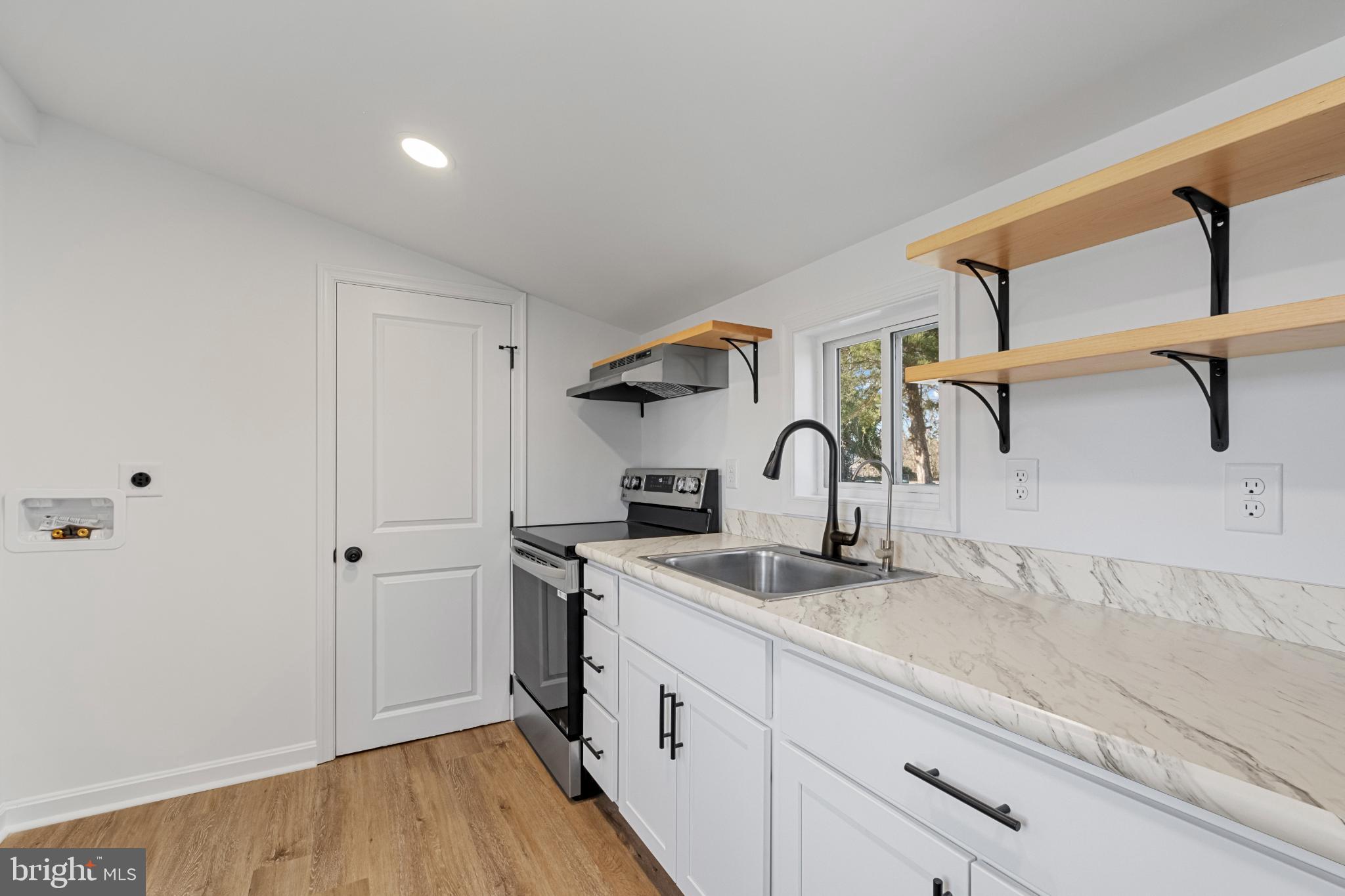 28276 Riverside Drive Salisbury, MD 21801 - Photo 14 of 24 Modern kitchen with sleek finishes.