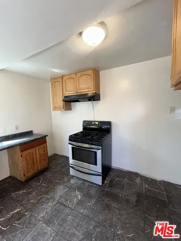 a kitchen with stainless steel appliances a sink and a stove