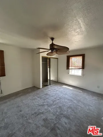 a view of a kitchen with a sink and a window