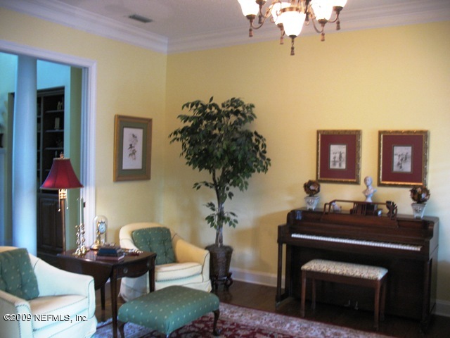 12142 Mandarin Road Jacksonville, FL 32223 - Photo 14 of 50 a living room with furniture and flowers