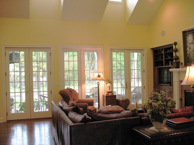 12142 Mandarin Road Jacksonville, FL 32223 - Photo 26 of 50 a living room with furniture and floor to ceiling windows