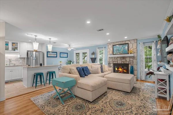 a living room with furniture and a fireplace
