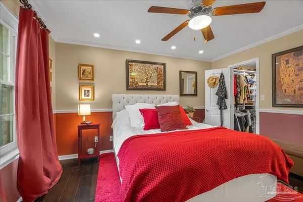 a bed room with a bed and a chandelier