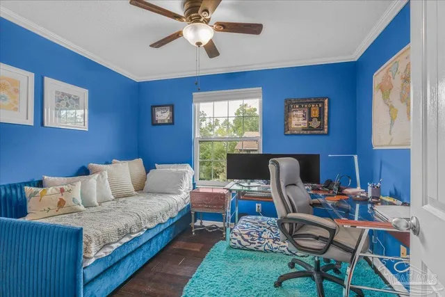 a work room with furniture and a window