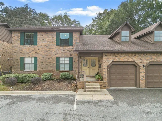 a view of a back yard from a balcony