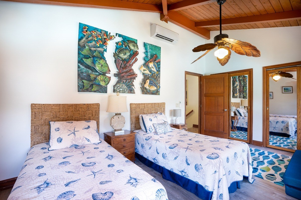 1871 Pe'e Road, Unit 2 Koloa, HI 96756 - Photo 13 of 25 a bedroom with a bed and ceiling fan
