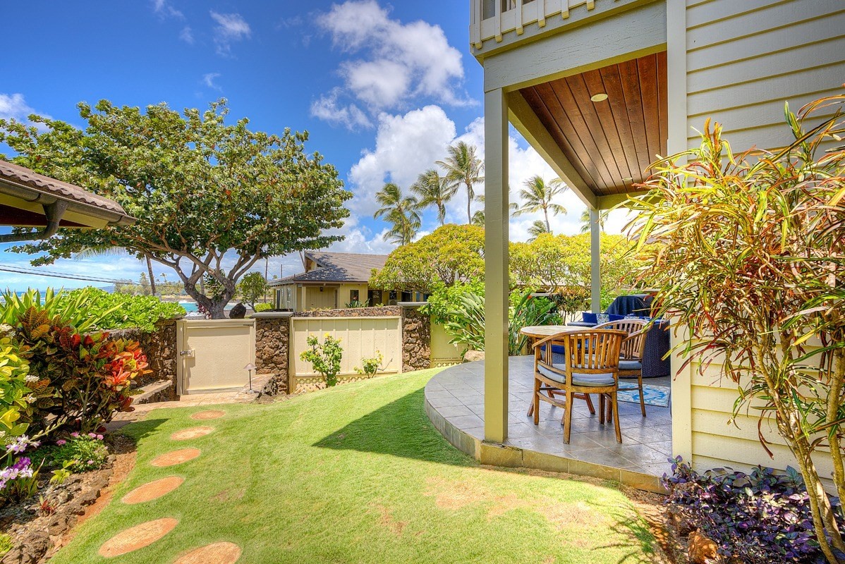 1871 Pe'e Road, Unit 2 Koloa, HI 96756 - Photo 19 of 25 a swimming pool with outdoor seating and yard