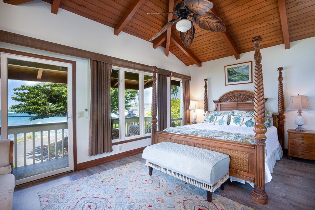 1871 Pe'e Road, Unit 2 Koloa, HI 96756 - Photo 9 of 25 a bedroom with a bed and wooden floor