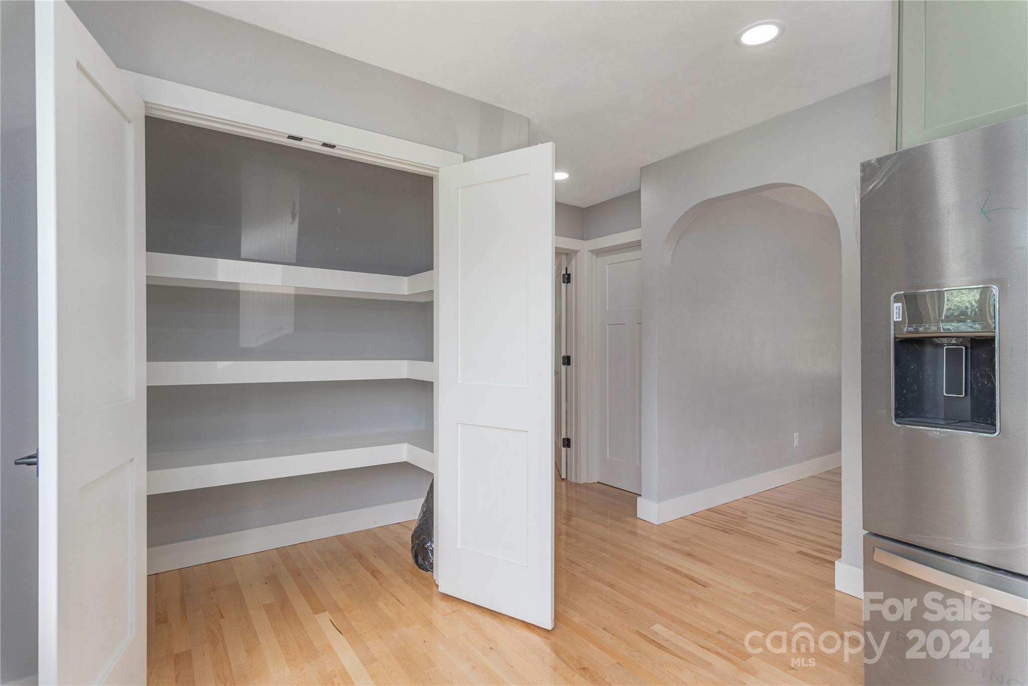 1045 North Canton Road Canton, NC 28716 - Photo 11 of 26 a view of walk in closet with empty racks