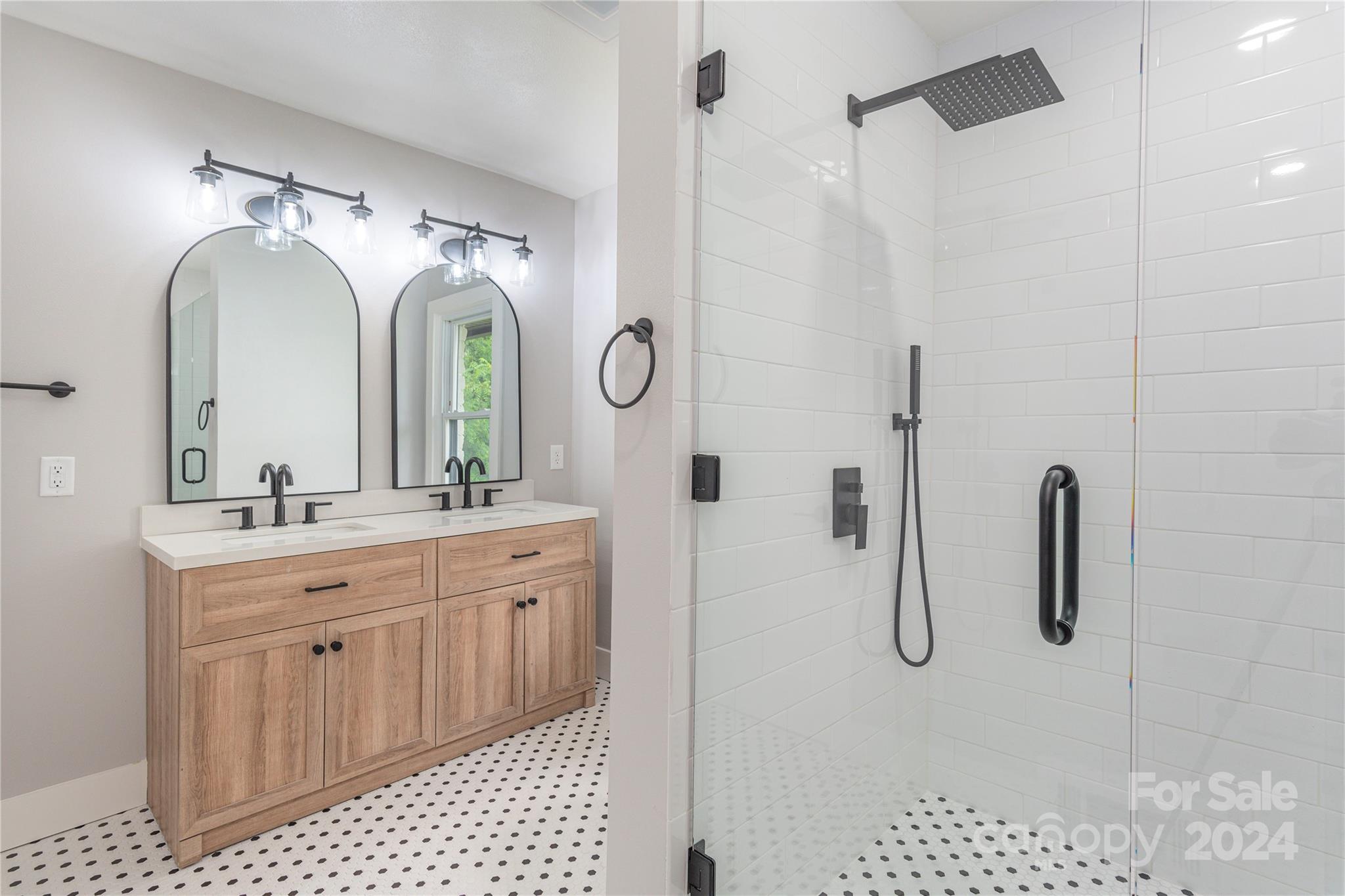 1045 North Canton Road Canton, NC 28716 - Photo 18 of 26 a bathroom with a double vanity sink mirror and shower