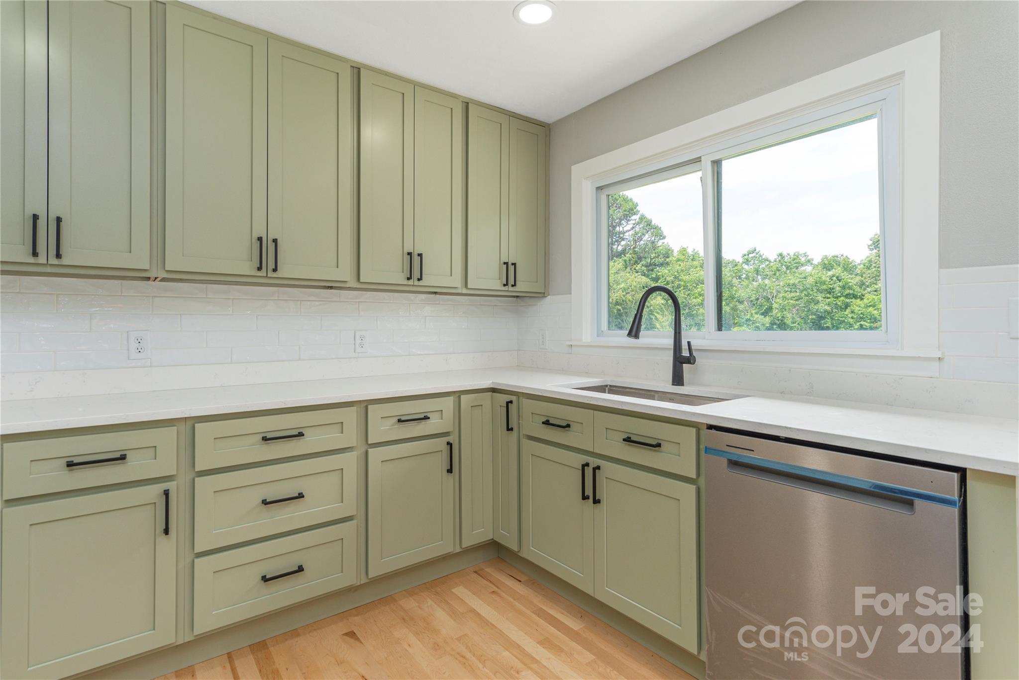1045 North Canton Road Canton, NC 28716 - Photo 8 of 26 a kitchen with a sink cabinets and window
