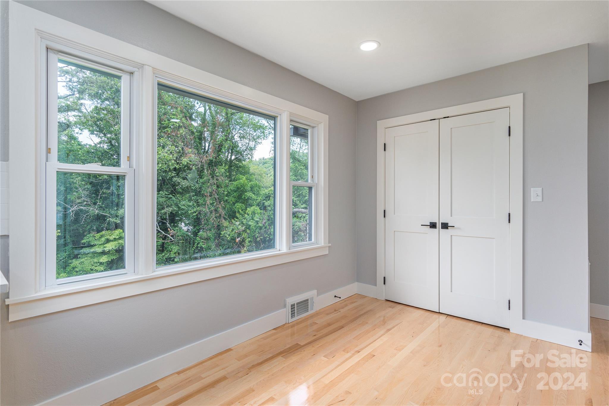 1045 North Canton Road Canton, NC 28716 - Photo 10 of 26 a view of an empty room with a window