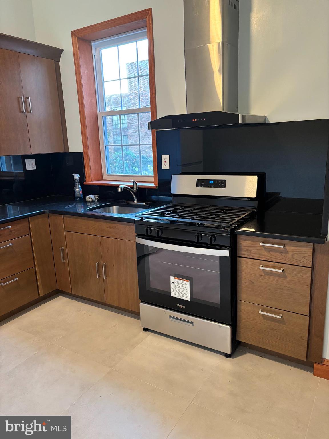 1320 West Girard Avenue, Unit 2ND 1 Philadelphia, PA 19123 - Photo 3 of 6 a kitchen with stainless steel appliances granite countertop a stove a sink and a microwave
