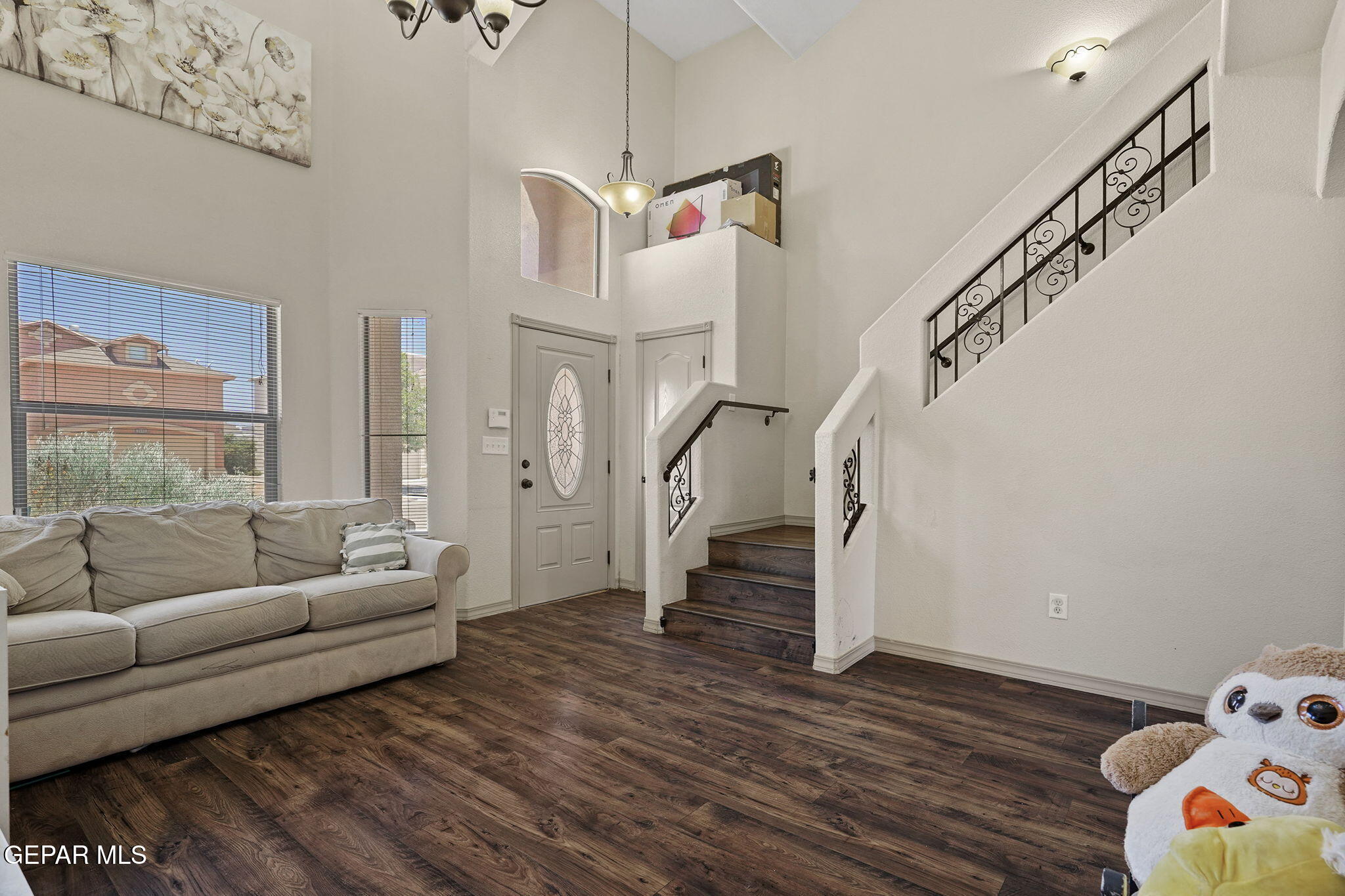 3152 Rustic Hidden Drive El Paso, TX 79938 - Photo 7 of 38 a living room with furniture and wooden floor