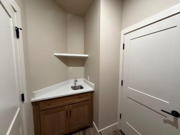a bathroom with a sink and mirror