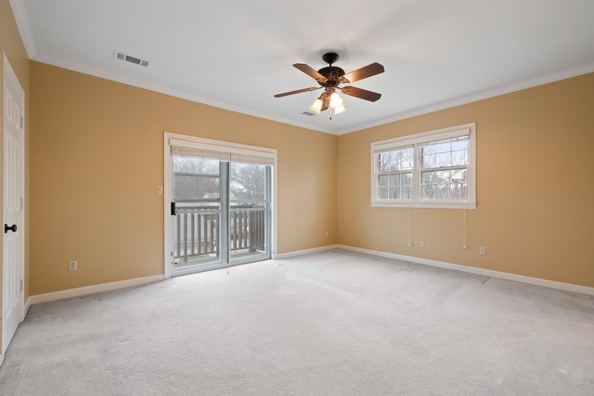 1683 Kimbrough Road Germantown, TN 38138 - Photo 14 of 34 Spare room featuring carpet floors, crown molding, and a ceiling fan
