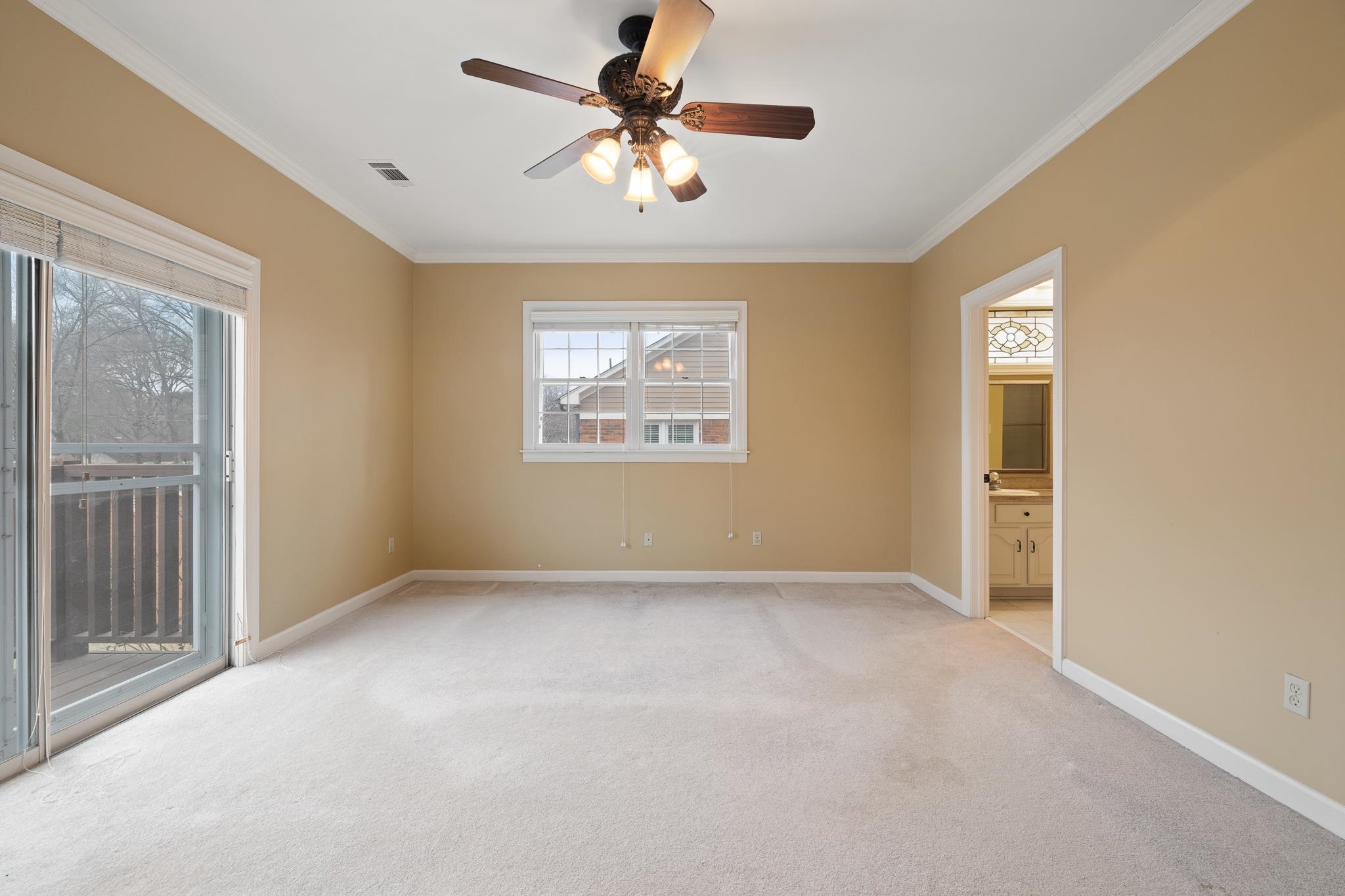 1683 Kimbrough Road Germantown, TN 38138 - Photo 15 of 34 Empty room with ceiling fan, ornamental molding, and light carpet