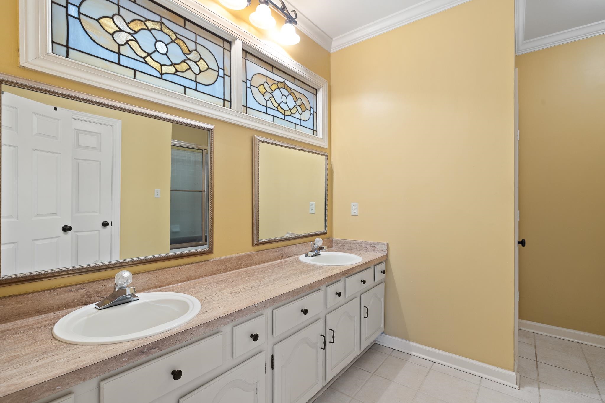 1683 Kimbrough Road Germantown, TN 38138 - Photo 18 of 34 Full bathroom featuring double vanity, ornamental molding, and light tile patterned floors