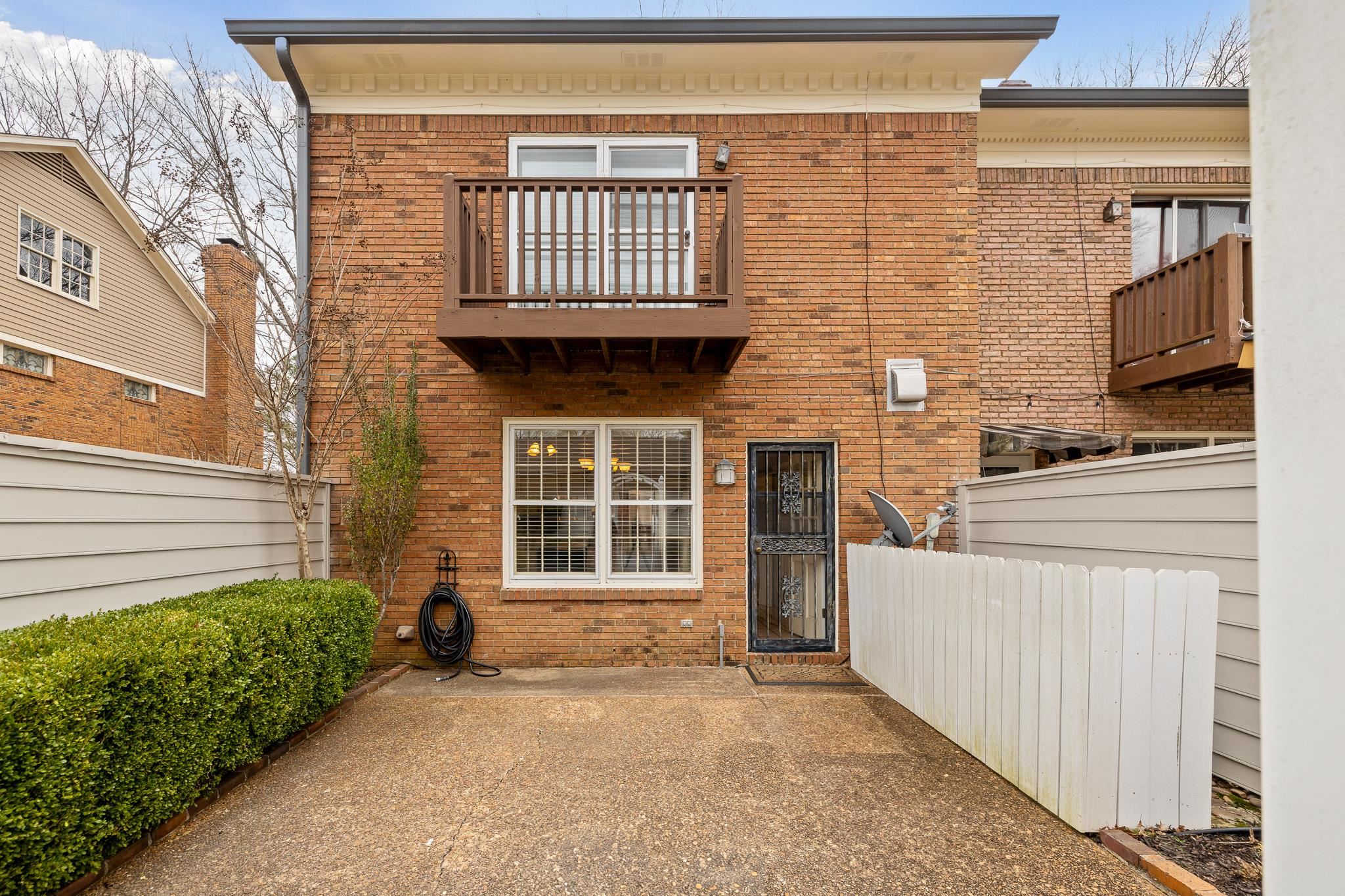 1683 Kimbrough Road Germantown, TN 38138 - Photo 31 of 34 Back of house with brick siding, a balcony, and a patio area