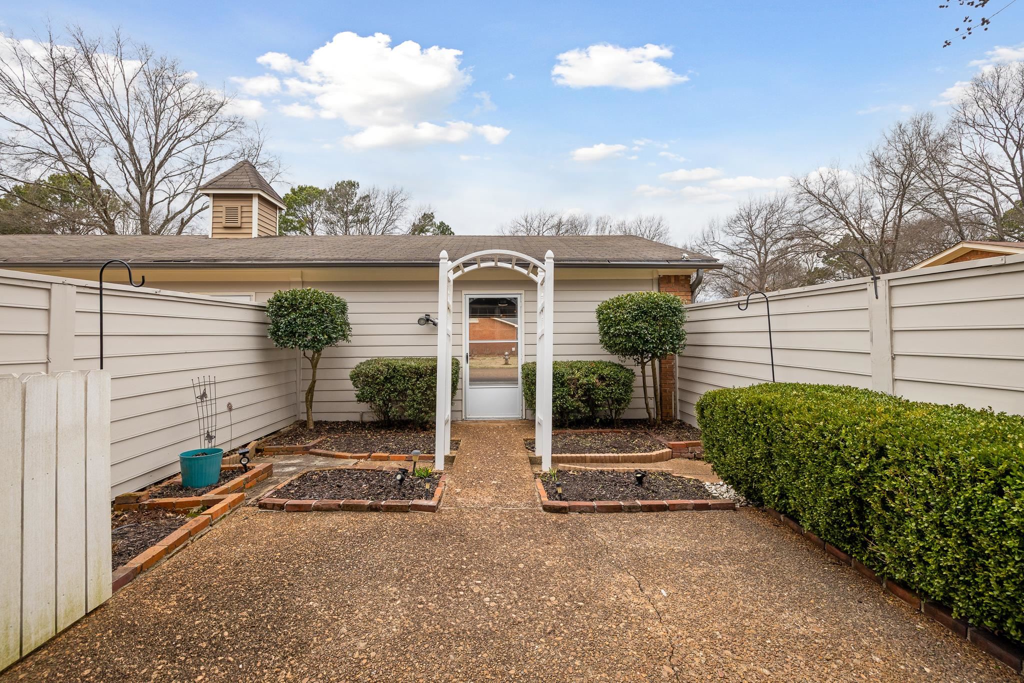 1683 Kimbrough Road Germantown, TN 38138 - Photo 32 of 34 View of exterior entry with roof with shingles