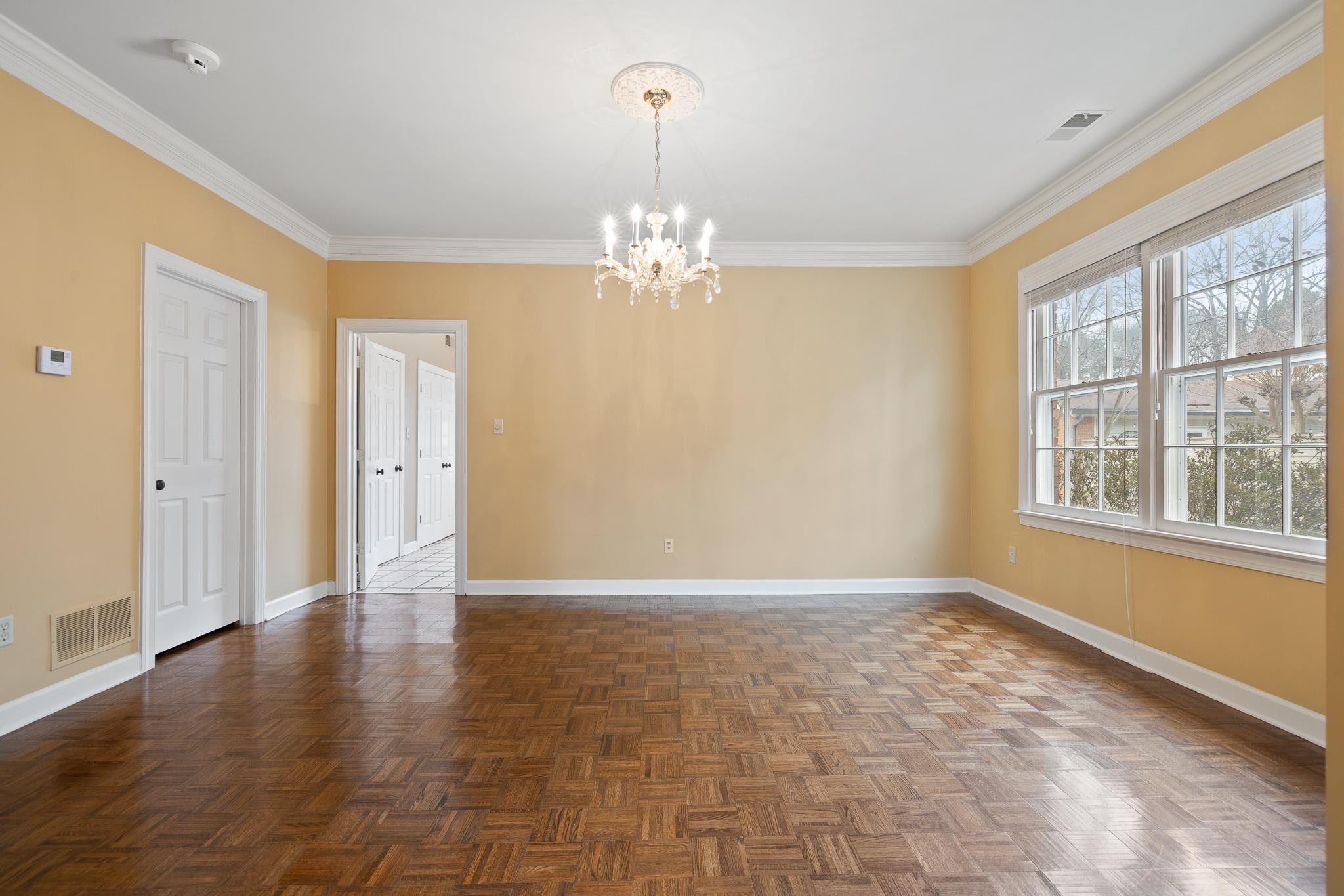 1683 Kimbrough Road Germantown, TN 38138 - Photo 6 of 34 Spare room with hanging lights, ornamental molding, and parquet floors