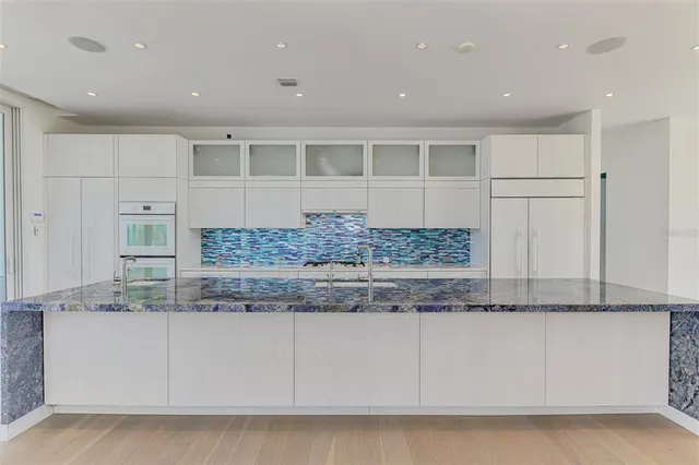 a view of cabinets a counter top space and cabinets